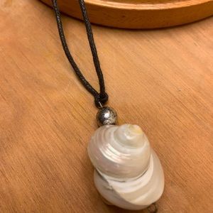 Large shell with pearl necklace